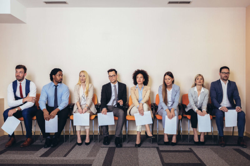 Photo of candidates waiting for a job interview. Enterprise ATS.